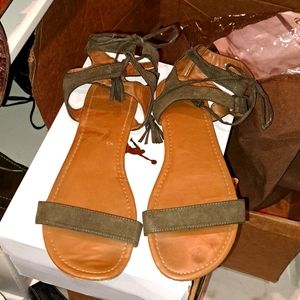 A pair of lace over the ankle sandals.